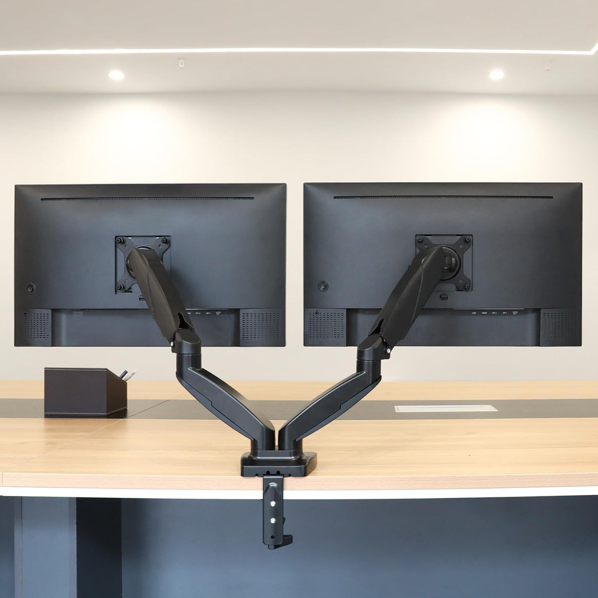 Amazon Basics Gas Spring Dual Monitor Arm Desk Mount, Adjustable Tension, Fits 15–27 Inch Monitors, Supports 4.4–15.4 lbs Each Arm, VESA 75x75/100x100, Black